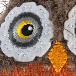 TIAKI Happy Owl kissanmintulla